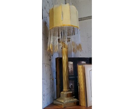 A polished brass Corinthian column table lamp with 1920's style beaded shade, plinth base, 56cm high 