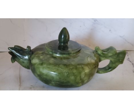 A Chinese Jade teapot and cover,&nbsp; bird spout,&nbsp; bud knop, 17m wide 