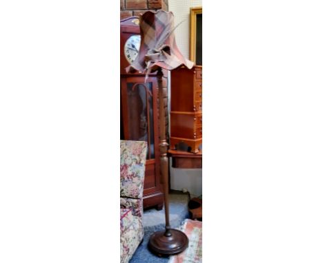 An early 20th century mahogany fluted standard lamp, tweed shade, with pheasant feathers, 190cm high approx, c.1920 