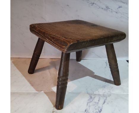 A 19th century elm milking stool, square top, ring turned legs, 18cm high, 20cm wide, c.1890 