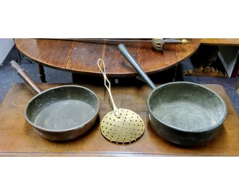 A Victorian copper roll top pan, metal handle, 31cm wide, c.1860;&nbsp; another, turned wooden handle top, 33cm diam;&nbsp; a