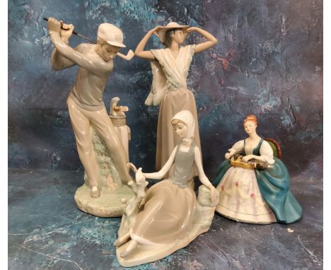 A Lladro figure, of a Golfer, 27cm high;&nbsp; others;&nbsp; a Royal Doulton figure, Hurdy Gurdy, HN2796 (4) 