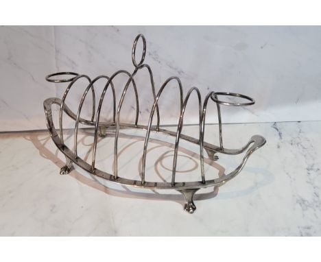 A George III Old Sheffield Plate Neo-classical boat shaped seven bar toast rack ring loop handle, 22cm diam, c.1790 