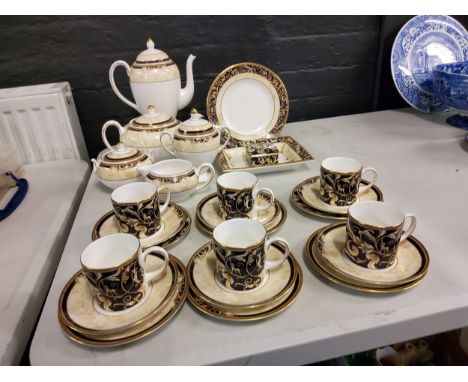 A set of six Wedgwood Cornucopia coffee cans, saucers and and side plates, coffee pot, sugar bowl, milk jug,&nbsp; two side p