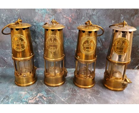 An Eccles The Protector Lamp and Lighting Co Ltd miner's lamp, Type 6;&nbsp; three others, similar (4) 
