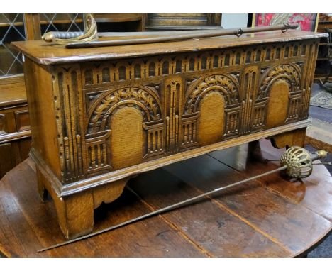 A Titchmarsh&nbsp;&amp;&nbsp;Goodwin oak blanket box, carved with three arches and egg and dart details, bracket feet, 49cm h