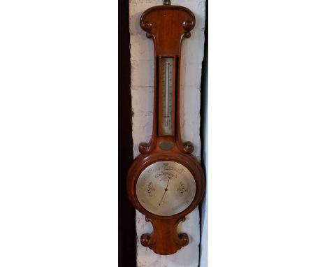 A Victorian mahogany onion top barometer, silvered dial, inscribed Finnigans Manchester, mercury thermometer, 86cm high, c.18
