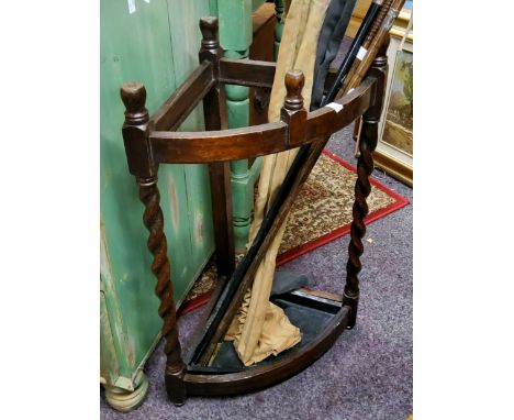 An early 20th century oak corner stick stand, barley twist supports, metal liner, 67cm high, c.1930 