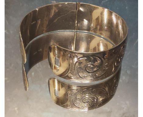 A Charles Horner hinged bangle/cuff, chased and engraved with scrolls, Charles Horner, Chester, 1937 42.75g 