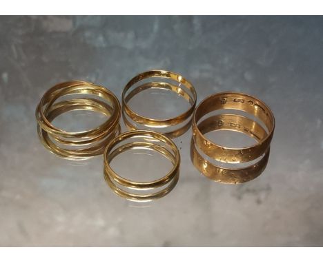 A 9ct rose gold band, size O, 2.16g; a 9ct three gold Russian wedding ring, size O, 1.89g; a yellow metal possibly Dutch, wed