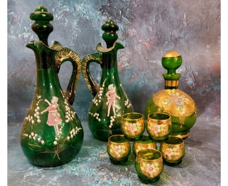 A pair of Mary Gregory green glass decanters, painted with a boy and a girl amongst snowdrops, 32cm high, c.1880;&nbsp; a Boh