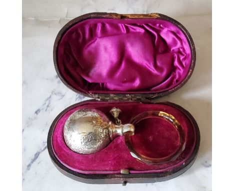 A Victorian globular rattle, engraved with scrolling foliage, teething ring, 8.5cm long, London 1883, cased 
