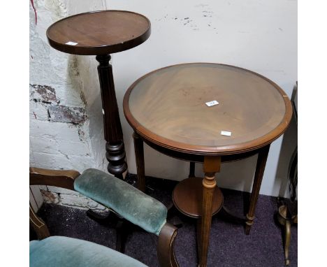 A contemporary mahogany circular occasional table, glass top, fluted legs, shelf stretcher, 55cm diam, 72cm high;&nbsp; a rep