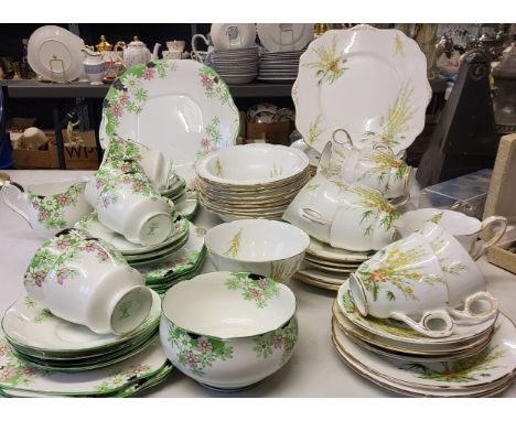 A Crown Staffordshire Broom pattern tea service, for nine, comprising teacups, saucers, side plates, dessert plates and bowls