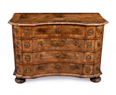 A German walnut inverted bow front commode, third quarter 18th century, the crossbanded top above four drawers, on later bun 