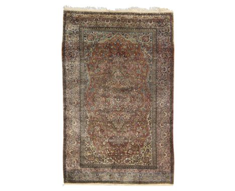 A Persian silk Kashan 'Mohtasham' rug, first quarter 20th century, the central floral medallion surrounded by foliate motifs,