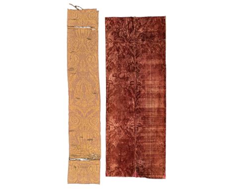 A joined panel of stamped crimson velvet, 18th century, worked with a pattern of flowers and trellis, 247.5 x 101cm; together