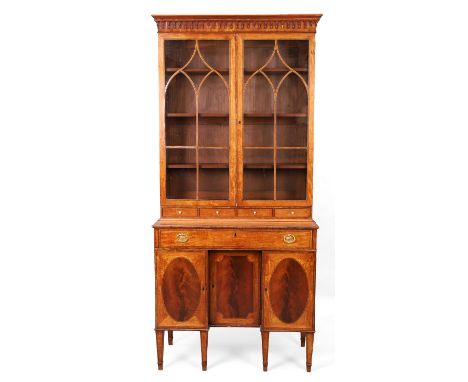 A George III line inlaid and kingwood crossbanded satinwood secretaire bookcase, last quarter 18th century, the moulded corni