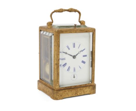 A French brass repeating carriage clock, mid-19th century, the cast one-piece case with chased decoration, the foliate handle