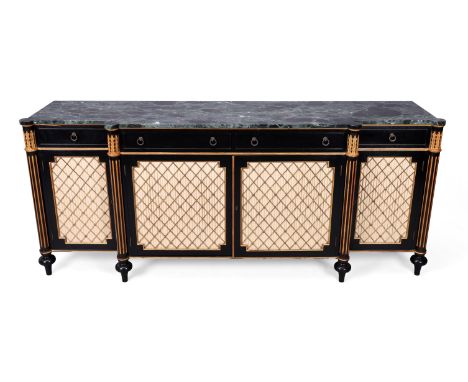An English ebonised and parcel gilt breakfront sideboard, of Regency style, second half 20th century, with marble top above f