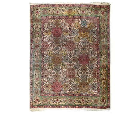 A Persian Tabriz carpet, last quarter 20th century, the central field with seven floral medallions, surrounded by floral and 