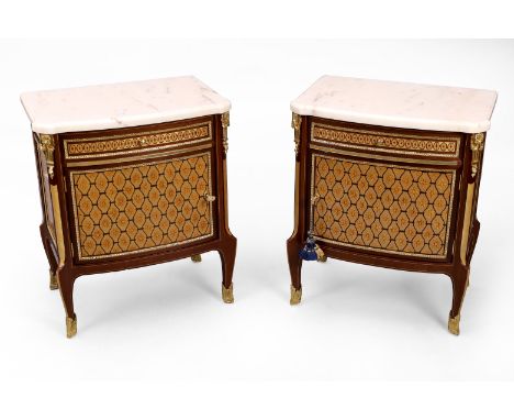 A pair of modern Italian gilt-metal mounted inlaid mahogany bedside cabinets, after a design by Jean Henri Riesener, the marb