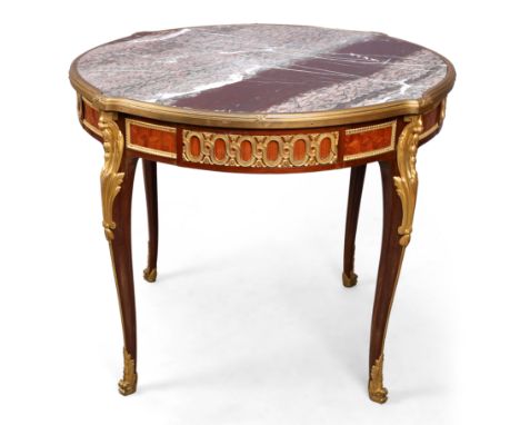 A French ormolu-mounted mahogany and walnut centre table, by François Linke, of Louis XVI style, first quarter 20th century, 