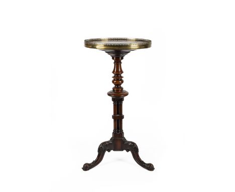 A George IV brass-mounted rosewood tripod table, first quarter 19th century, the base attributed to Gillows, the top associat