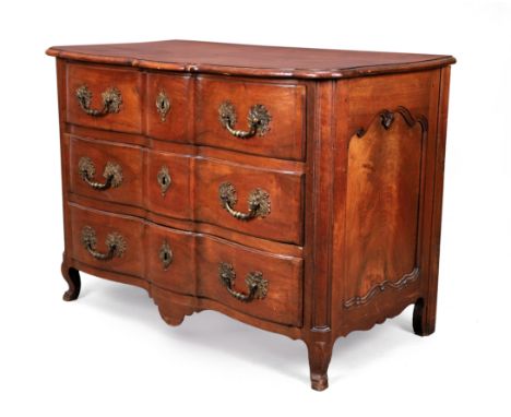 A provincial Louis XV walnut commode, first quarter 18th century, with three drawers, on cabriole feet, 87cm high, 119cm wide