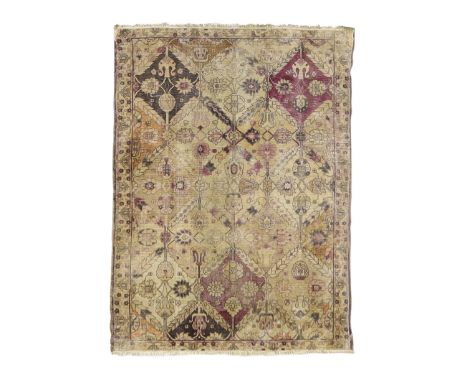 A fragment of a Turkish silk Koum Kapi rug, first quarter 20th century, with stylised floral design, 90 x 65cmProvenance: The