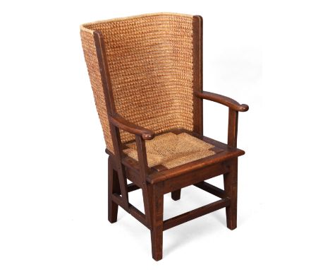 A Scottish oak Orkney child's chair, in the manner of David Kirkness, first quarter 20th century,&nbsp;the woven straw back t