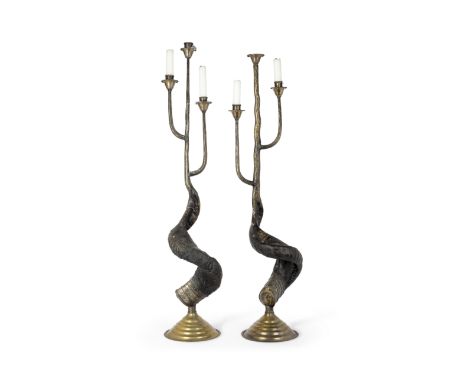 A pair of brass-mounted ram's horn three-light candlesticks, in the manner of Anthony Redmile, late 20th century, with applie