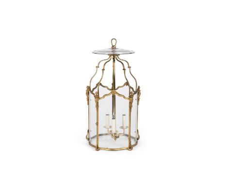 A large French gilt-bronze three-light hall lantern, of Louis XV style, late 19th century, of hexagonal serpentine form with 