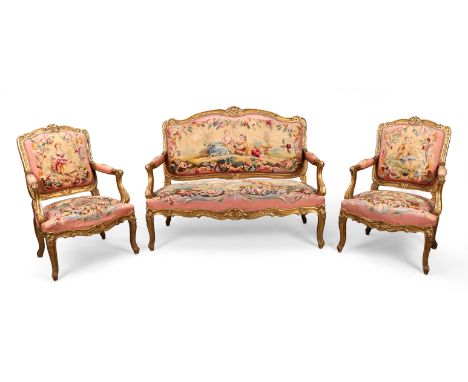 A French giltwood salon suite, of Louis XV style, first quarter 20th century, comprising a canape and four fauteuils, with pi
