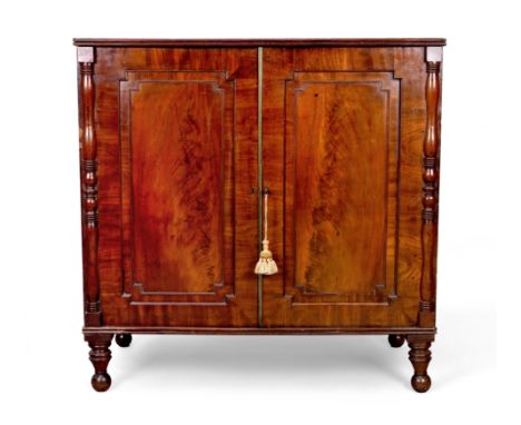 A Regency mahogany cupboard chest, first quarter 19th century, with two doors enclosing two short over three long graduated d