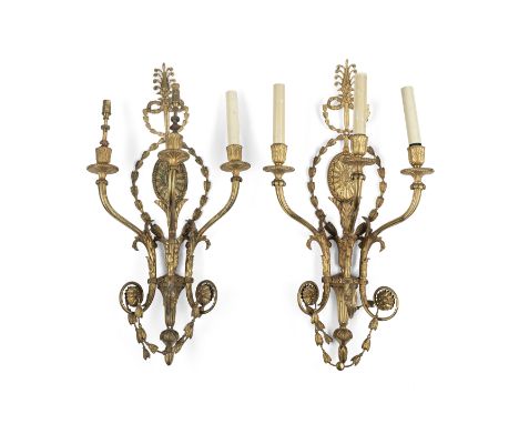 A pair of English gilt-bronze three-light wall appliques, in the manner of Robert Adam, early 20th century, each with medalli