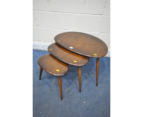 A MID CENTURY ERCOL DARK ELM PEBBLE NEST OF THREE TABLES, largest table width 66cm x depth 54cm x height 40cm (condition repo