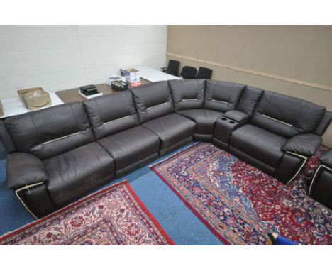A LARGE BROWN LEATHER ELECTRIC RECLINING CORNER SOFA, each end reclines and one section with two cup holders and storage comp