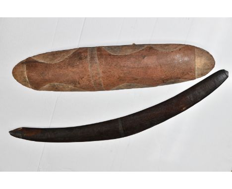 AN EARLY ABORIGINAL WOODEN HAND SHIELD, carved decoration to the front ends, sides and middle, carved verso to the ends with 