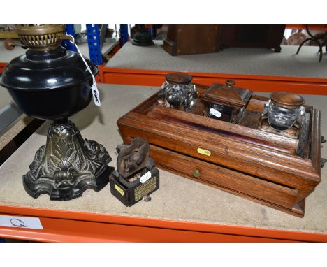 THREE PIECES OF VINTAGE DESKWARE to include a 19th century rosewood desk stand with two rounded glass inkwells, a square jar,
