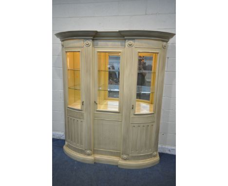A LATE 20TH CENTURY FRENCH CREAM FINISH DISPLAY CABINET,  with triple glazed doors, enclosing an illuminated interior and gla