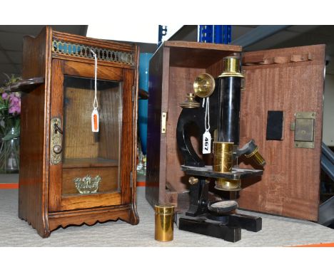 A VICTORIAN MICROSCOPE AND AN OAK SMOKER'S CABINET, comprising a wooden cased microscope with two lenses in brass containers 