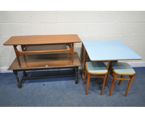 A MID CENTURY PALE BLUE FORMICA TOP GATE LEG TABLE, and two stools, along with an oak coffee table and a mid-century teak cof