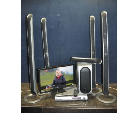 A TECHNIKA 23.6in TV WITH REMOTE and a LG Home cinema System with DVD controller, remote, four tower speakers, a centre speak