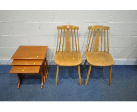 A PAIR OF ERCOL STYLE SPINDLE BACK CHAIRS, with a central splat, a pine table, a nest of three tables, a stool, along with a 