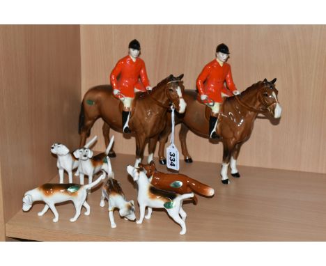 A GROUP OF BESWICK FOX HUNTING FIGURES, comprising 'Huntsman Standing', model 1501, together with a pack of Foxhounds, compri