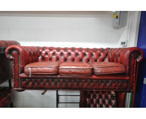 A BURGUNDY LEATHER CHESTERFIELD SOFA, width 188cm x depth 85cm x height 68cm (condition report: with fire label, worn finish,