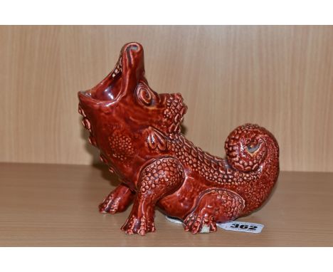 A BURMANTOFTS FAIENCE GROTESQUE SPOON WARMER, pattern no 1906, in the form of a lizard or crocodile like creature with an ope