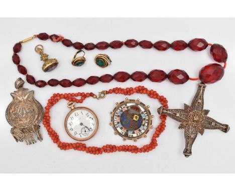 A SMALL BAG OF ASSORTED ITEMS, to include an enamel Victorian coin dated 1889, in a yellow metal mount with applied bead work