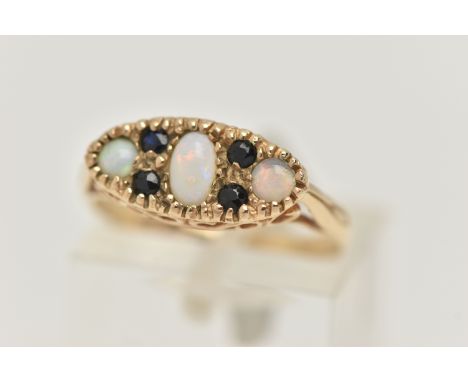 A 9CT GOLD OPAL AND SAPPHIRE RING, designed as an oval and two circular opal cabochons, interspaced by circular cut sapphires